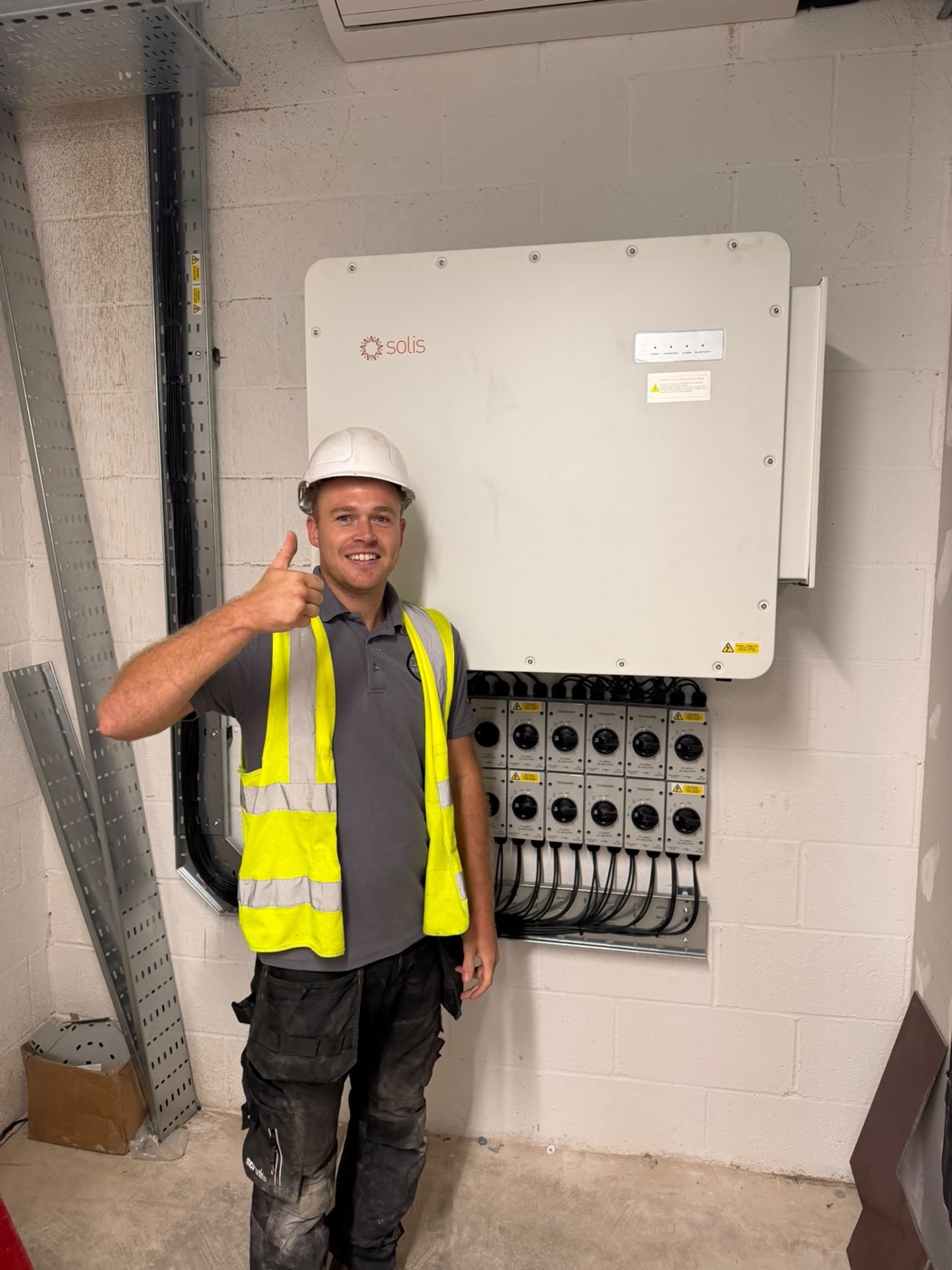 Oaks Electrical electrician after completing a solar inverter installation